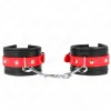 KINK - WRIST RESTRAINTS BLACK WITH RED BELT ADJUSTABLE 17-28 CM X 6 CM